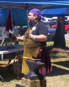 Geof speaking at a blacksmithing demonstration.