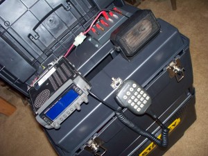 A large toolbox with an amateur radio (Kenwood TM-V7A) mounted inside.