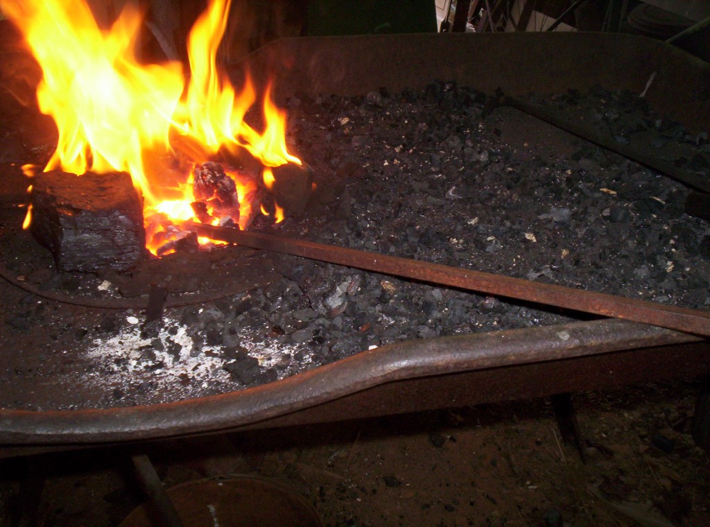 The stock back under the coals with a flames about eight inches over the coals.