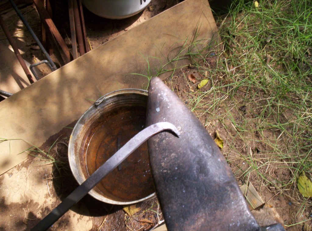 The stock is turned ninety-degrees and you can see the start of the pig-tail - a short curl on the end of the stock.