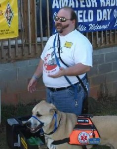 Geof and Copper the Service Dog teaching a class.