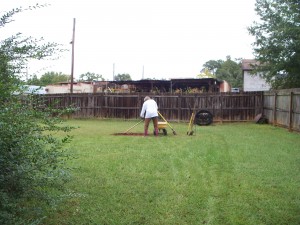 Barbara working on clearing the soil from the fire pit area.