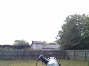 Looking along the top of the telescope at the clouds that obscure the Sun.