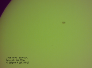 A picture of the surface of the Sun near the edge of the solar disc. A cluster of dark spots are to the right side of the image and comprise sunspot # 2542.